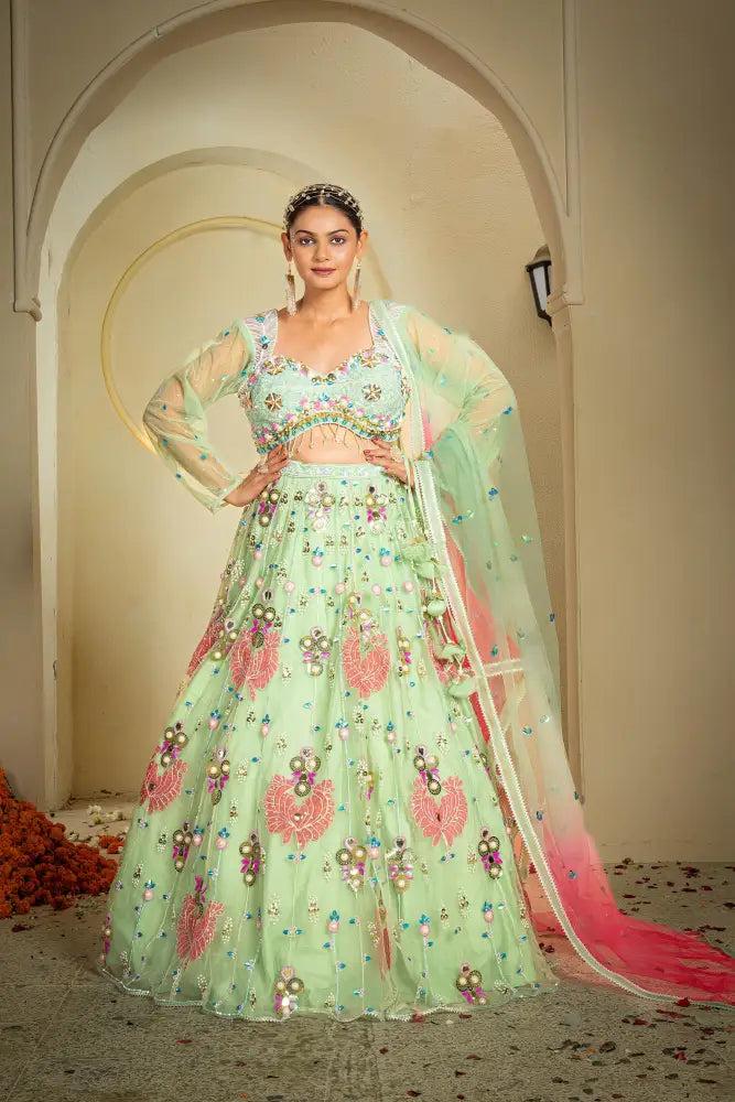 Mint lehenga with pink floral motifs